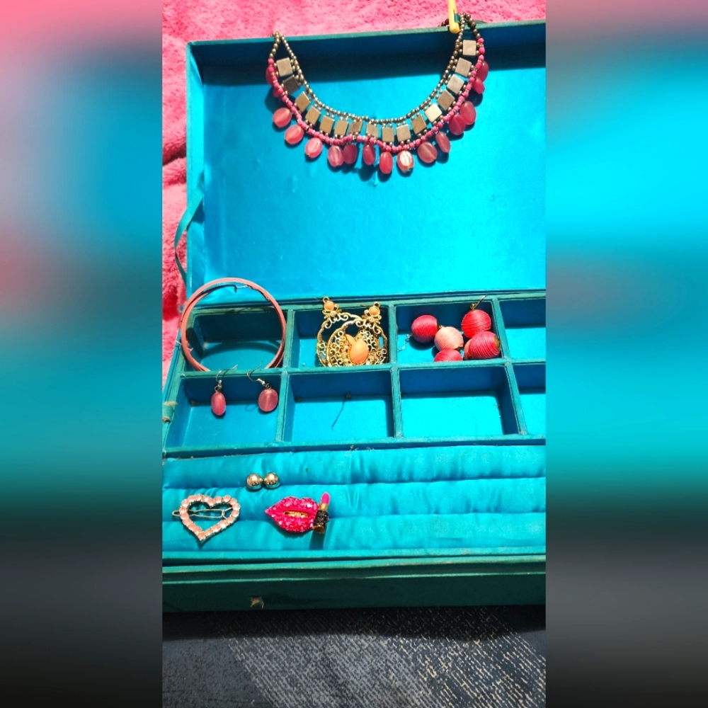 A women's pink and silver necklace set